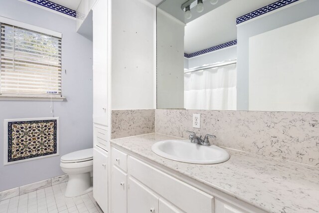 4007 Edgerock Dr, Austin, TX 78731 - bathroom featuring vanity, toilet, tile patterned flooring, a shower with shower curtain, and backsplash