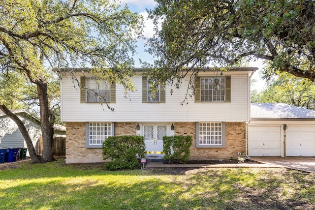 4007 Edgerock Dr, Austin, TX 78731 - colonial home featuring brick siding, a garage, and a front lawn