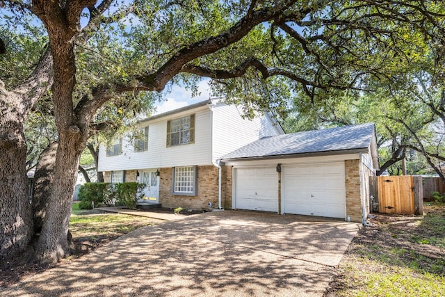 4007 Edgerock Dr, Austin, TX 78731 - colonial home featuring brick siding, a garage, and concrete driveway