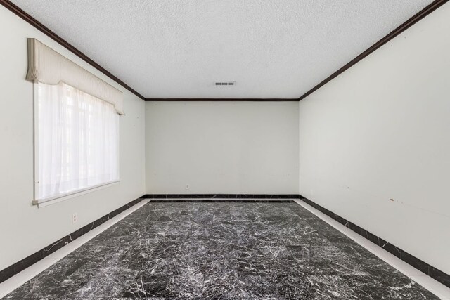 4007 Edgerock Dr, Austin, TX 78731 - spare room with crown molding, a textured ceiling, and baseboards