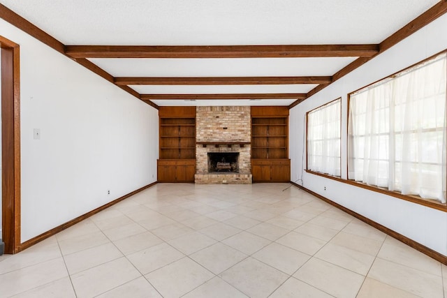 4007 Edgerock Dr, Austin, TX 78731 - unfurnished living room featuring baseboards, beam ceiling, a brick fireplace, and built in shelves