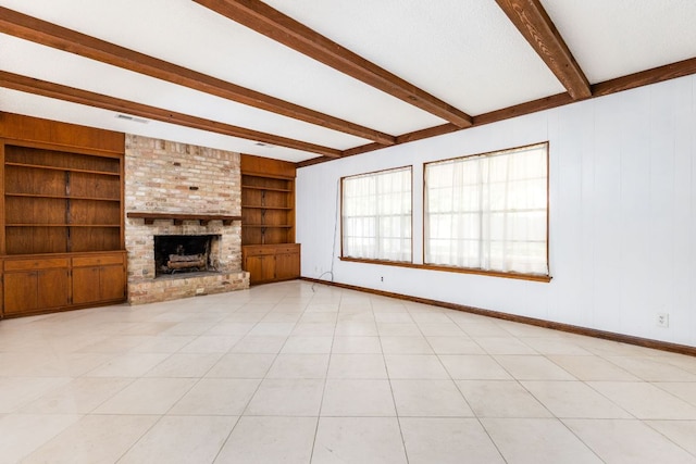 4007 Edgerock Dr, Austin, TX 78731 - unfurnished living room with beamed ceiling, baseboards, built in shelves, and a fireplace