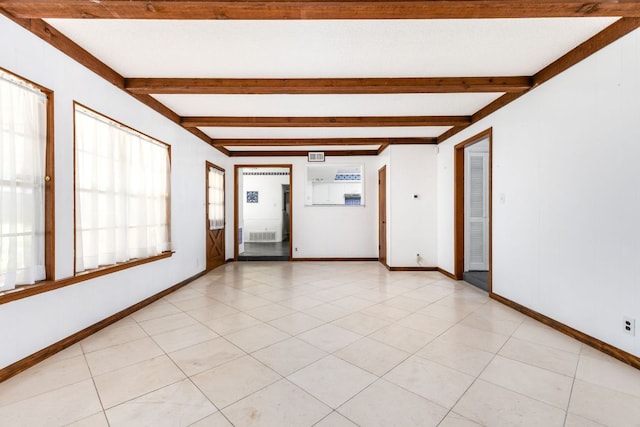 4007 Edgerock Dr, Austin, TX 78731 - empty room featuring beamed ceiling and baseboards