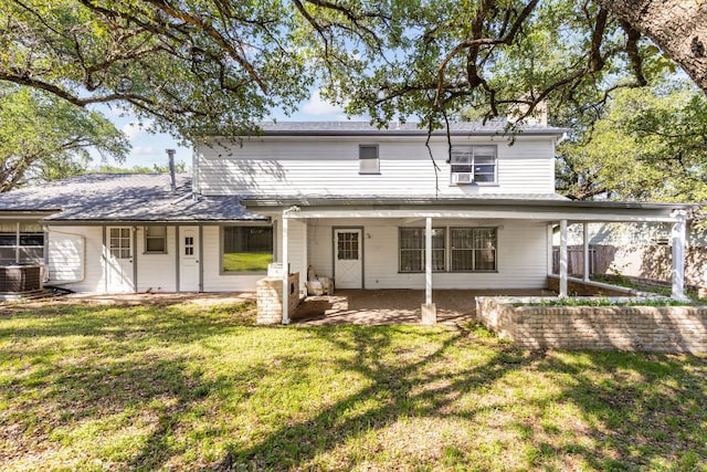 4007 Edgerock Dr, Austin, TX 78731 - rear view of house featuring central AC, a yard, and a patio