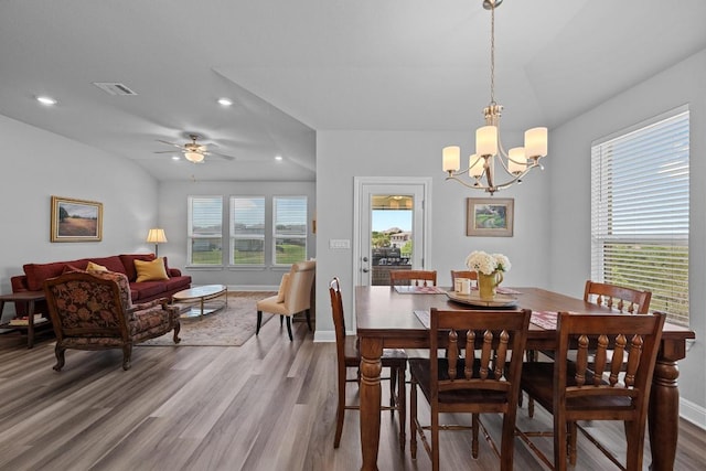 dining room featuring wood finished floors, a chandelier, recessed lighting, baseboards, and ceiling fan