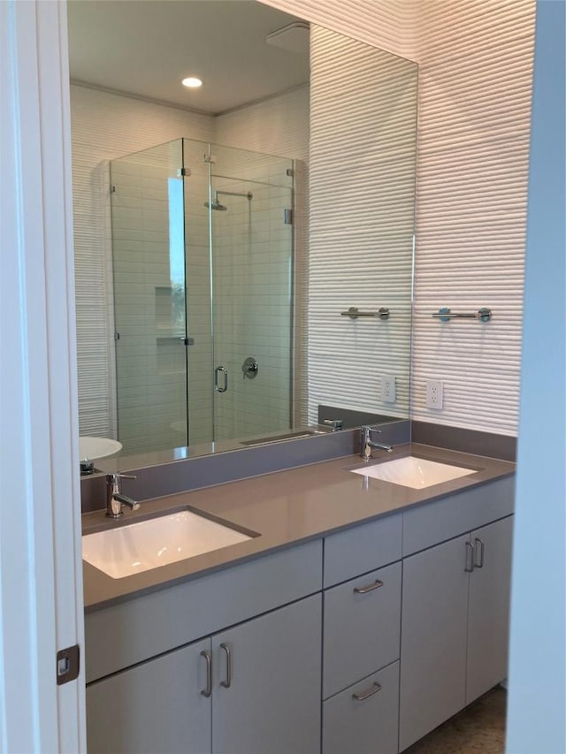 112 Rough Creek Rd, Georgetown, TX 78628 - bathroom with a shower stall, double vanity, and recessed lighting