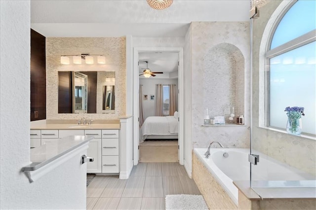 1513 Burr Pkwy, Leander, TX 78641 - full bathroom featuring vanity, a bath, tile patterned floors, ensuite bathroom, and ceiling fan