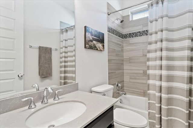 full bath featuring toilet, shower / bath combo with shower curtain, and vanity
