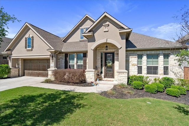 1513 Burr Pkwy, Leander, TX 78641 - view of front of property with stone siding, stucco siding, a front lawn, and driveway