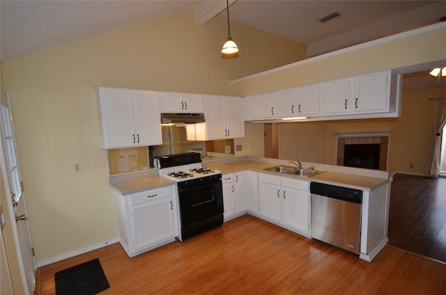 kitchen with gas range, dishwasher, under cabinet range hood, a sink, and light countertops