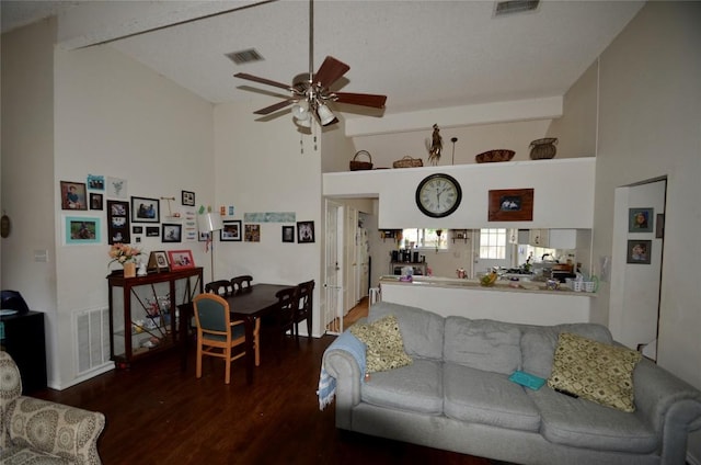 living room with wood finished floors, ceiling fan, beamed ceiling, and high vaulted ceiling