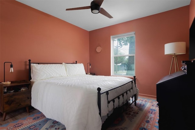 4906 Hilldale Dr, Austin, TX 78723 - bedroom with a ceiling fan, wood finished floors, and baseboards