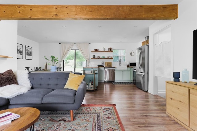 4906 Hilldale Dr, Austin, TX 78723 - living room featuring dark wood-style floors and beamed ceiling