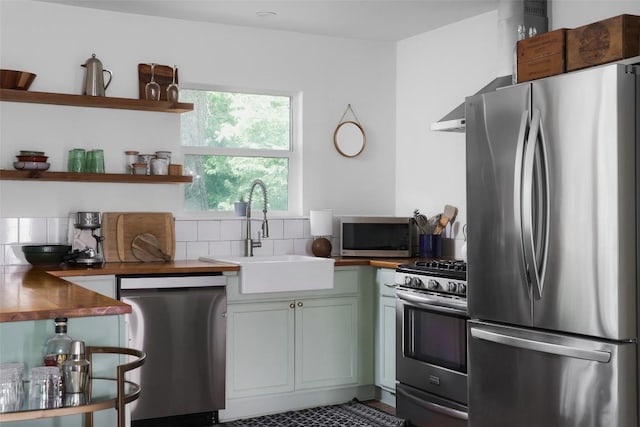 4906 Hilldale Dr, Austin, TX 78723 - kitchen with stainless steel appliances, a sink, open shelves, and tasteful backsplash