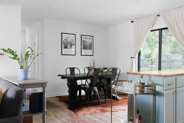 4906 Hilldale Dr, Austin, TX 78723 - dining area featuring light wood-style floors and baseboards