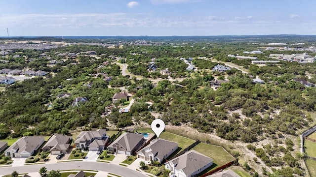 aerial view of property's location with nearby suburban area
