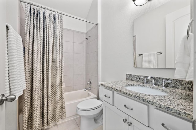 full bathroom with shower / tub combo with curtain, toilet, vanity, and tile patterned flooring