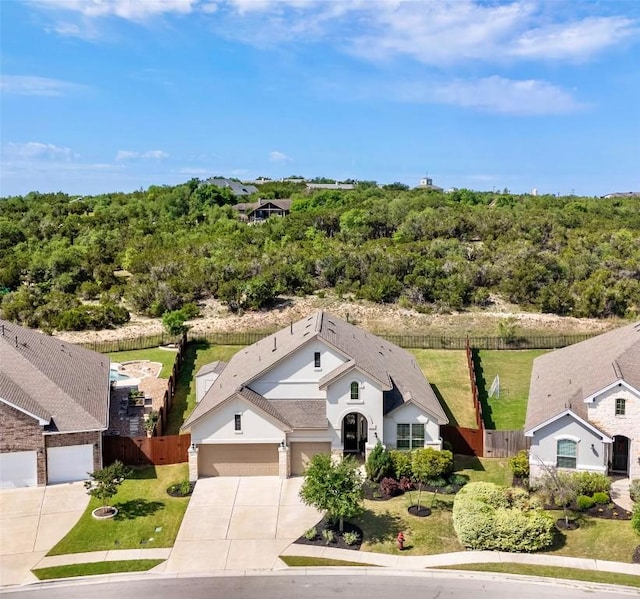 view of front of home featuring driveway and a garage