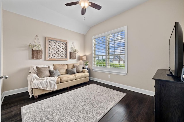 living room with ceiling fan, baseboards, lofted ceiling, and dark wood-style flooring