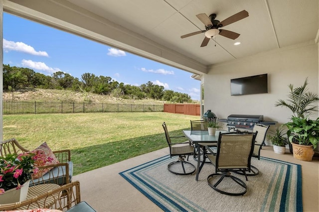 view of patio with ceiling fan, outdoor dining area, and grilling area