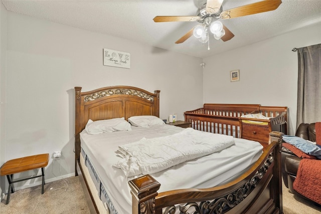 515 Sierra Cv, Round Rock, TX 78664 - bedroom with light carpet, a textured ceiling, a ceiling fan, and baseboards