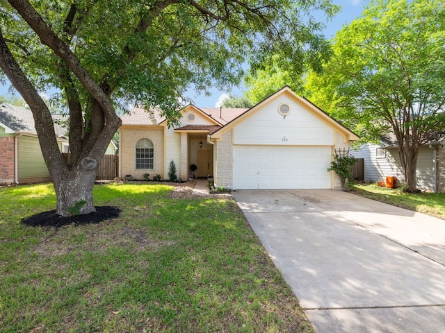 903 Deer Grove Dr, Cedar Park, TX 78613 - view of front of house with concrete driveway, an attached garage, and brick siding