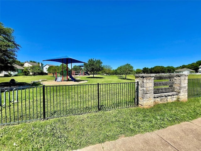 view of property's community with a playground