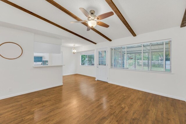 9811 Hansford Dr, Austin, TX 78753 - empty room featuring ceiling fan, baseboards, wood finished floors, and a chandelier