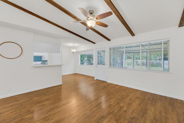 9811 Hansford Dr, Austin, TX 78753 - unfurnished living room with ceiling fan, wood finished floors, and a chandelier