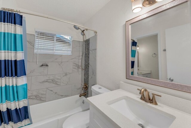 9811 Hansford Dr, Austin, TX 78753 - bathroom featuring toilet, shower / bath combination with curtain, and vanity