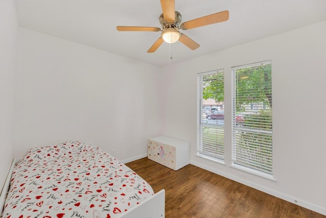 9811 Hansford Dr, Austin, TX 78753 - bedroom featuring baseboards, wood finished floors, and a ceiling fan