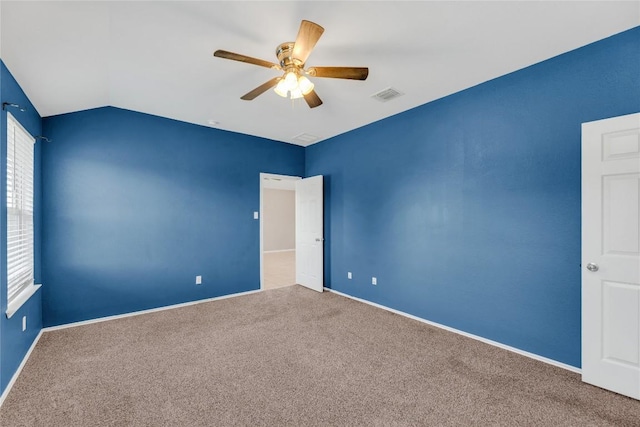 625 Taggart Trl, Jarrell, TX 76537 - spare room with carpet, ceiling fan, baseboards, and lofted ceiling