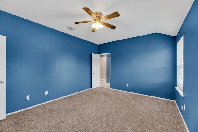 625 Taggart Trl, Jarrell, TX 76537 - spare room featuring a ceiling fan, carpet flooring, baseboards, and vaulted ceiling