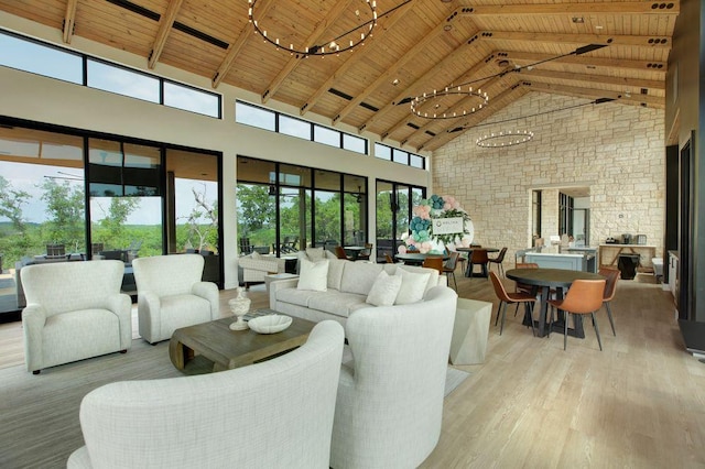 305 Golden Sage Ave, Georgetown, TX 78633 - living room featuring high vaulted ceiling, a wood ceiling with exposed beams, a chandelier, wood finished floors, and brick wall