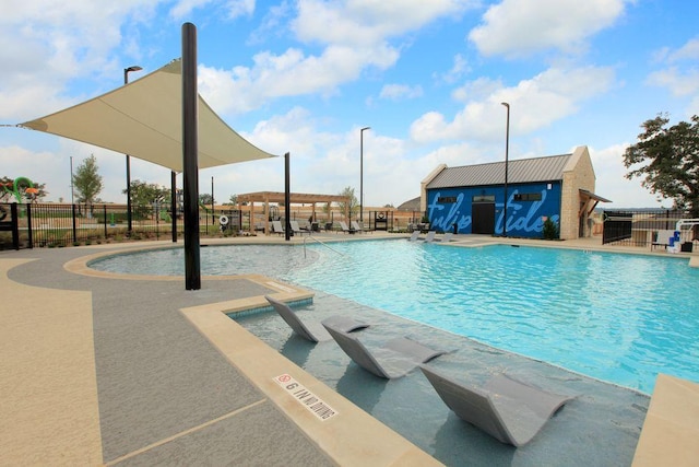 305 Golden Sage Ave, Georgetown, TX 78633 - community pool featuring a patio area