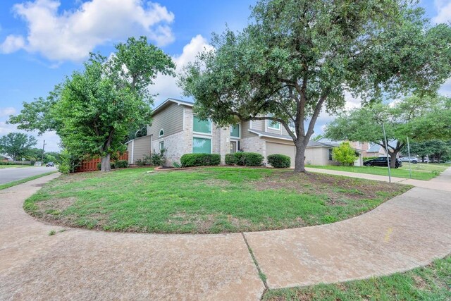 3400 Settlement Dr, Round Rock, TX 78665 - view of front of property featuring a front lawn, driveway, and a garage