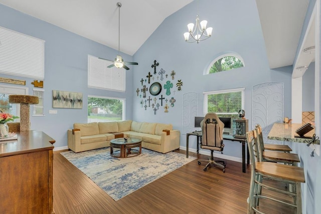 3400 Settlement Dr, Round Rock, TX 78665 - living area with high vaulted ceiling, dark wood-style flooring, ceiling fan, baseboards, and a chandelier