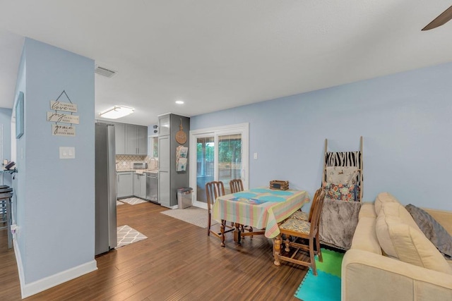 3400 Settlement Dr, Round Rock, TX 78665 - dining room with dark wood-style flooring, baseboards, recessed lighting, and ceiling fan