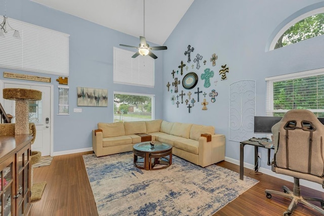 3400 Settlement Dr, Round Rock, TX 78665 - living room featuring high vaulted ceiling, healthy amount of natural light, baseboards, and wood finished floors