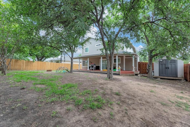3400 Settlement Dr, Round Rock, TX 78665 - back of property with a shed, a fenced backyard, and an outbuilding