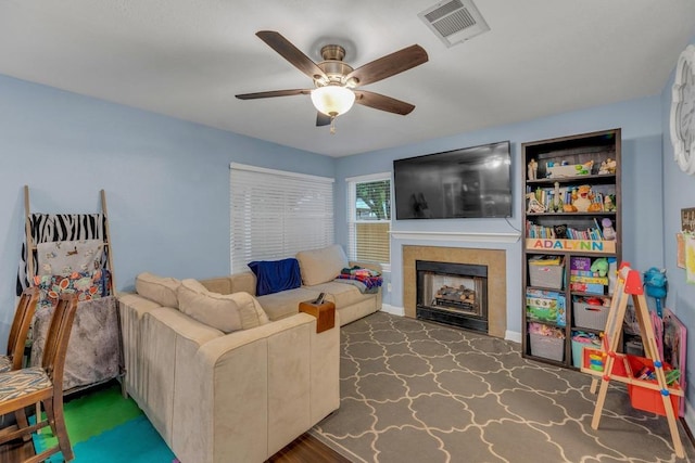 3400 Settlement Dr, Round Rock, TX 78665 - living area featuring ceiling fan and a fireplace