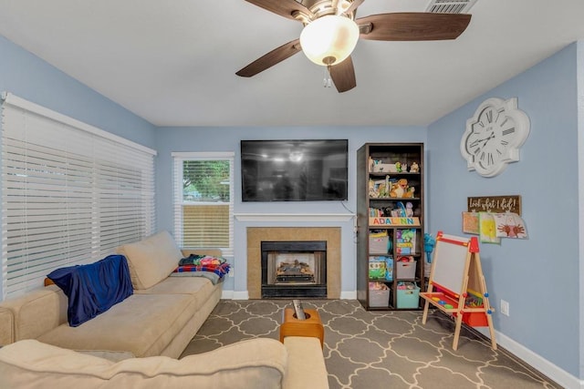 3400 Settlement Dr, Round Rock, TX 78665 - living area with ceiling fan, a fireplace, baseboards, and built in shelves