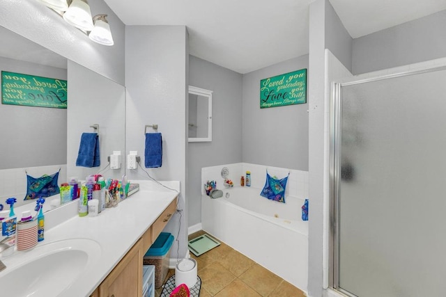 3400 Settlement Dr, Round Rock, TX 78665 - bathroom featuring vanity, tile patterned floors, a stall shower, and a bath