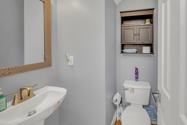 3400 Settlement Dr, Round Rock, TX 78665 - half bathroom featuring a sink and toilet