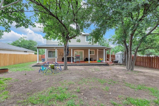 3400 Settlement Dr, Round Rock, TX 78665 - back of property with a storage shed, a fenced backyard, and an outdoor structure