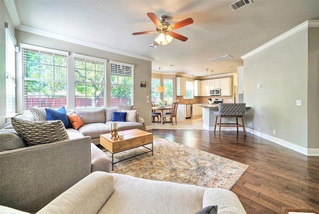 11805 Lake Stone Dr, Austin, TX 78738 - living area featuring crown molding, wood-type flooring, ceiling fan, and baseboards
