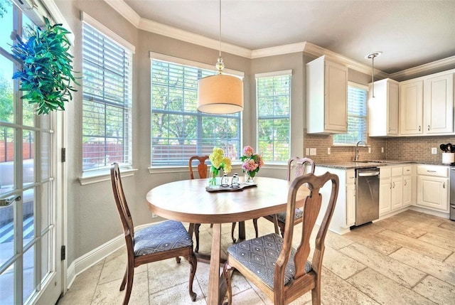 11805 Lake Stone Dr, Austin, TX 78738 - dining room with stone tile floors, plenty of natural light, baseboards, and ornamental molding