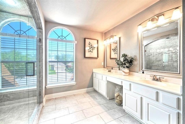 11805 Lake Stone Dr, Austin, TX 78738 - bathroom with double vanity, a shower stall, baseboards, and tile patterned flooring