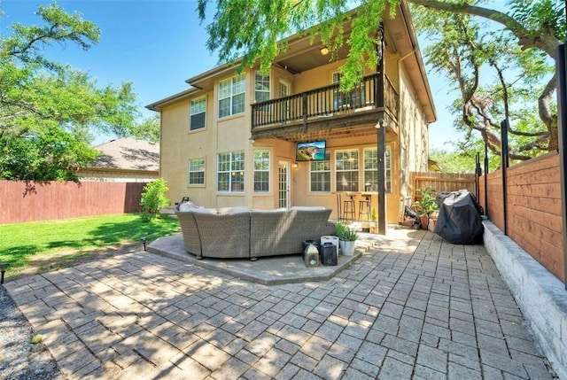 11805 Lake Stone Dr, Austin, TX 78738 - rear view of house featuring a balcony, outdoor lounge area, stucco siding, and a patio area