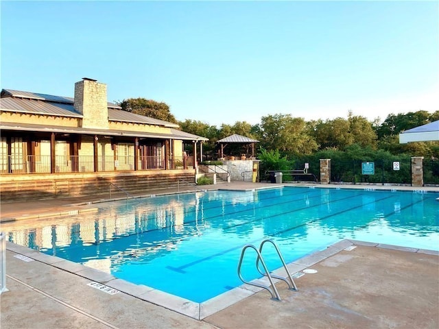 11805 Lake Stone Dr, Austin, TX 78738 - community pool featuring a gazebo and a patio
